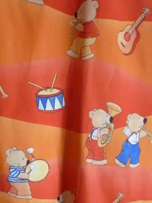 Tissu motif clown 150 x 73 cm orange — image 2
